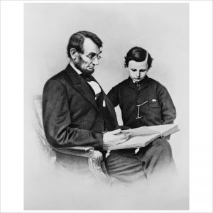 Abraham Lincoln and his son Tad Looking at an Album of Photographs